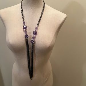 I think this is a Vera Wang long necklace. Purple round fake crystal beads.